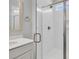 Modern bathroom features a tiled shower with glass door, brushed gold fixtures, and a recessed toiletry niche at 138 Brown Swiss Cir, Summerville, SC 29483
