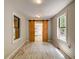 Bedroom with a modern barn door and two windows, providing ample natural light at 1384 Tibwin Rd, McClellanville, SC 29458