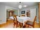 Cozy dining room featuring hardwood floors, natural light, and easy access to the kitchen at 1384 Tibwin Rd, McClellanville, SC 29458