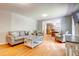 Cozy living room with hardwood floors, comfortable seating, and ample natural light at 1384 Tibwin Rd, McClellanville, SC 29458