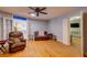 Living room with hardwood floors, furniture, open doors, and plenty of natural light at 1384 Tibwin Rd, McClellanville, SC 29458