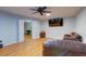 Cozy living room with hardwood floors, a ceiling fan, and a flat-screen television at 1384 Tibwin Rd, McClellanville, SC 29458