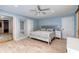 Comfortable bedroom featuring a neutral color palette, ample natural light, and wood-look flooring at 1384 Tibwin Rd, McClellanville, SC 29458