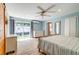 Spacious bedroom features sliding glass doors to the backyard and a modern ceiling fan at 1384 Tibwin Rd, McClellanville, SC 29458