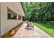 Inviting back porch with outdoor seating, overlooking a lush, green backyard, perfect for relaxing outdoors at 1384 Tibwin Rd, McClellanville, SC 29458