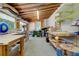Spacious workshop area with ample tables, shelving, and natural light, perfect for creative projects at 1384 Tibwin Rd, McClellanville, SC 29458