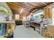 Well-lit workshop area with organized storage, offering a functional space for hobbies and crafts at 1384 Tibwin Rd, McClellanville, SC 29458