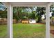 A large, well-maintained backyard with lush green grass, a white shed, and mature trees at 1417 Downing St, Charleston, SC 29407