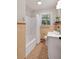 Cozy bathroom featuring tiled walls, window, and a combined tub and shower at 1417 Downing St, Charleston, SC 29407
