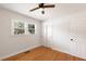 Bedroom features hardwood floors, updated windows, closet, and a ceiling fan at 1417 Downing St, Charleston, SC 29407