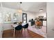 Bright dining area featuring a modern table, stylish chairs, and an adjacent kitchen at 1417 Downing St, Charleston, SC 29407