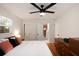 Spacious main bedroom featuring hardwood floors, ceiling fan and an open en-suite bathroom at 1417 Downing St, Charleston, SC 29407