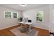 Bright office space with hardwood floors and natural light from the windows overlooking the yard at 1417 Downing St, Charleston, SC 29407