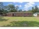 Spacious backyard with well-maintained lawn and brick home, ideal for outdoor enjoyment at 1520 Kirklees Abbey Dr, Charleston, SC 29407