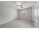Clean bedroom with carpet and neutral walls, complemented by a ceiling fan and a bright window at 1520 Kirklees Abbey Dr, Charleston, SC 29407