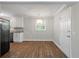 Bright kitchen with granite counters, white cabinets and stainless dishwasher at 1520 Kirklees Abbey Dr, Charleston, SC 29407