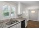 Kitchen view, stainless steel sink, granite counters, white cabinets, stainless dishwasher at 1520 Kirklees Abbey Dr, Charleston, SC 29407
