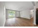 Spacious living room with wood floors, neutral walls, a ceiling fan, and abundant natural light at 1520 Kirklees Abbey Dr, Charleston, SC 29407
