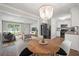 Inviting combined living space with wood floors, modern lighting, and open kitchen concept at 1520 Kirklees Abbey Dr, Charleston, SC 29407