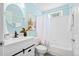 Bathroom featuring a modern vanity sink, framed mirror, tub, and blue painted walls at 170 Danzid Dr, Summerville, SC 29483