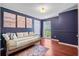 Bedroom featuring a full bed, decorative art, dark blue walls, and wood floors at 170 Danzid Dr, Summerville, SC 29483