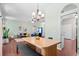 Open dining area featuring a modern chandelier and a dining table with bench seating at 170 Danzid Dr, Summerville, SC 29483