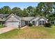 Single-story home featuring well-maintained landscaping and attached two-car garage at 170 Danzid Dr, Summerville, SC 29483