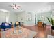 Open-concept living room with hardwood floors, contemporary furnishings, and ample natural light at 170 Danzid Dr, Summerville, SC 29483