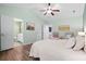Vaulted ceiling primary bedroom featuring an ensuite bath, ceiling fan, and wood-look floors at 170 Danzid Dr, Summerville, SC 29483