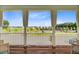 Scenic balcony with outdoor seating overlooking neighborhood and pond at 176 Midtown Ave, Summerville, SC 29486