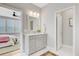 Bathroom featuring a gray vanity with double sinks, a decorative rug and access to the bedroom at 176 Midtown Ave, Summerville, SC 29486
