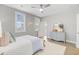 Serene bedroom with natural light, white bedding, and access to balcony at 176 Midtown Ave, Summerville, SC 29486