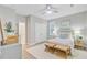 Bright bedroom with white furnishings, bamboo benches, and a ceiling fan at 176 Midtown Ave, Summerville, SC 29486