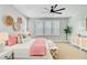 Comfortable bedroom with large windows, a ceiling fan, stylish decor and plush rug at 176 Midtown Ave, Summerville, SC 29486