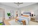 This is a bedroom with a ceiling fan, a mirror, and decorative wall art at 176 Midtown Ave, Summerville, SC 29486