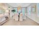 Bright dining room featuring white seating, stylish lighting, and contemporary decor at 176 Midtown Ave, Summerville, SC 29486