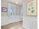 Clean, bright foyer featuring wainscoting and attractive views into the home at 176 Midtown Ave, Summerville, SC 29486