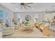 Inviting living room features neutral decor, a round mirror, wood floors, and comfortable seating, perfect for relaxation at 176 Midtown Ave, Summerville, SC 29486