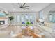 Airy living room featuring a fireplace, large glass doors to patio, comfortable seating, and a neutral color palette at 176 Midtown Ave, Summerville, SC 29486