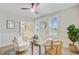 Bright office with white wainscoting, wood floors, french doors, and a modern desk, creating a perfect work-from-home space at 176 Midtown Ave, Summerville, SC 29486