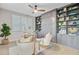 Stylish office featuring built-in shelving, designer seating, and ample natural light at 176 Midtown Ave, Summerville, SC 29486