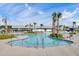 Resort style pool with shallow area, palm trees, and comfortable lounge chairs at 176 Midtown Ave, Summerville, SC 29486