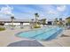 Stunning community pool featuring lounge chairs and palm trees on a sunny day at 176 Midtown Ave, Summerville, SC 29486