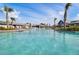 Beautiful turquoise community pool with a gradual slope entry and palm trees at 176 Midtown Ave, Summerville, SC 29486