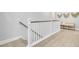 Staircase features white banisters and wood-look floors at 176 Midtown Ave, Summerville, SC 29486