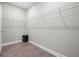Empty walk-in closet provides ample space for storage, featuring wire shelving and laminate floor at 176 Midtown Ave, Summerville, SC 29486