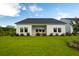 Well-maintained backyard with lush green grass and white exterior, perfect for outdoor activities at 177 Threaded Fern St, Summerville, SC 29485