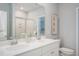 Bright primary bathroom with double sinks, large mirrors and elegant decor at 177 Threaded Fern St, Summerville, SC 29485