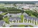 Aerial view of the neighborhood showcases the community pond and proximity to the school at 192 Buchanan Cir, Goose Creek, SC 29445