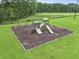 Community playground featuring swings, slides, and climbing structures on a safety-surfaced play area at 192 Buchanan Cir, Goose Creek, SC 29445